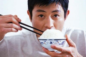 Man Eating Bowl of Rice فرهنگ غذا