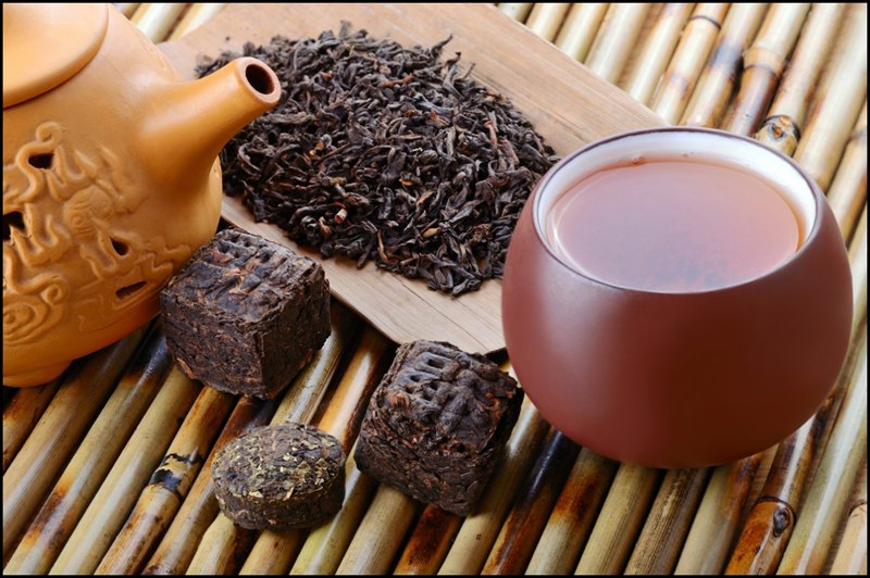 Chinese-black-pu-erh-tea-and-tea-leaves سنت چای