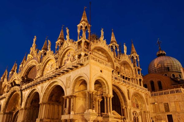 Basilica-di-San-Marco-illuminated-at-night-on-Piazza-San-Marco Basilica-di-San-Marco-illuminated-at-night-on-Piazza-San-Marco
