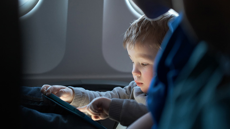 Little boy traveling in an airplane Little boy traveling in an airplane