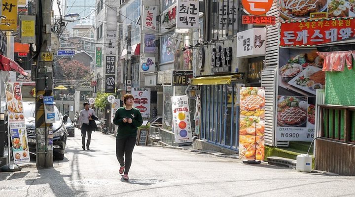 woman-walking-through-seoul woman-walking-through-seoul